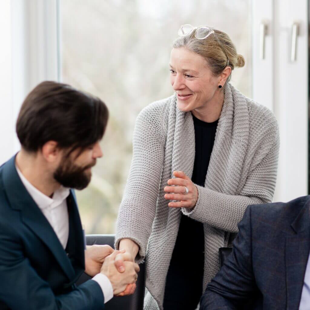 two members of nsb academy maritime training center handshake